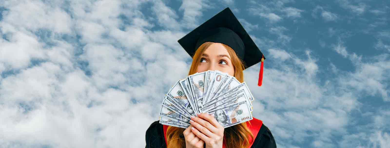 Graduate in cap and gown with scholarship money.